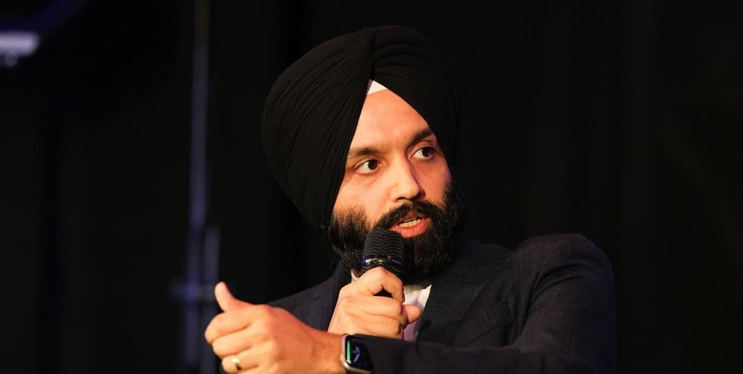 Gurpreet Singh speaking on stage